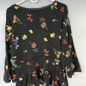 Black and embroidered flowers blouse, used.